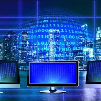 binary code in blue background with computer monitor